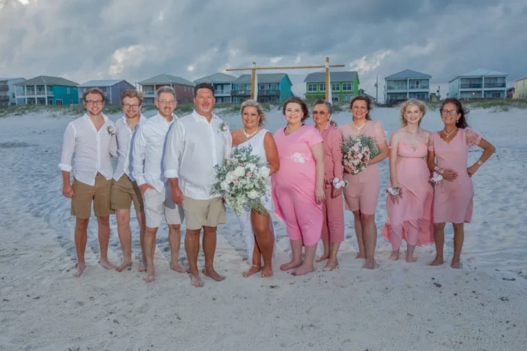 Gulf Shores Photography Image of the bridal party standing on the beach. party standing on the beach.