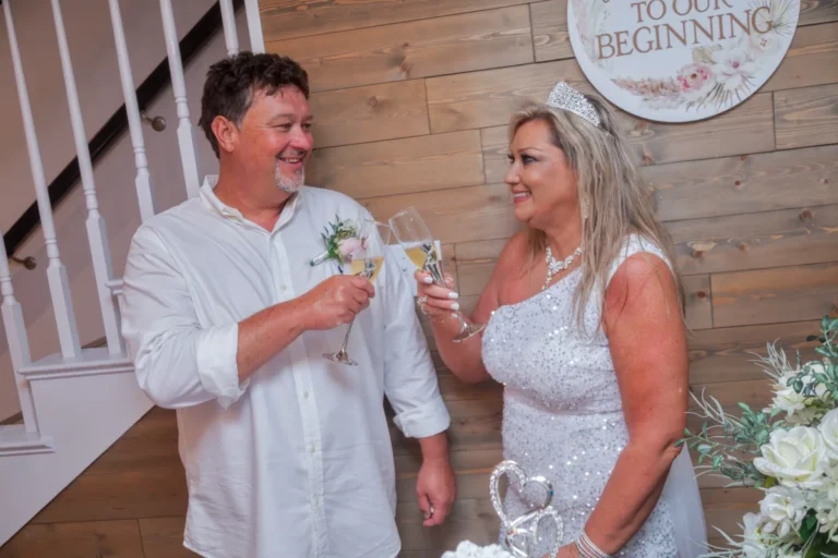 Orange Beach photographer, the bride and groom toast.