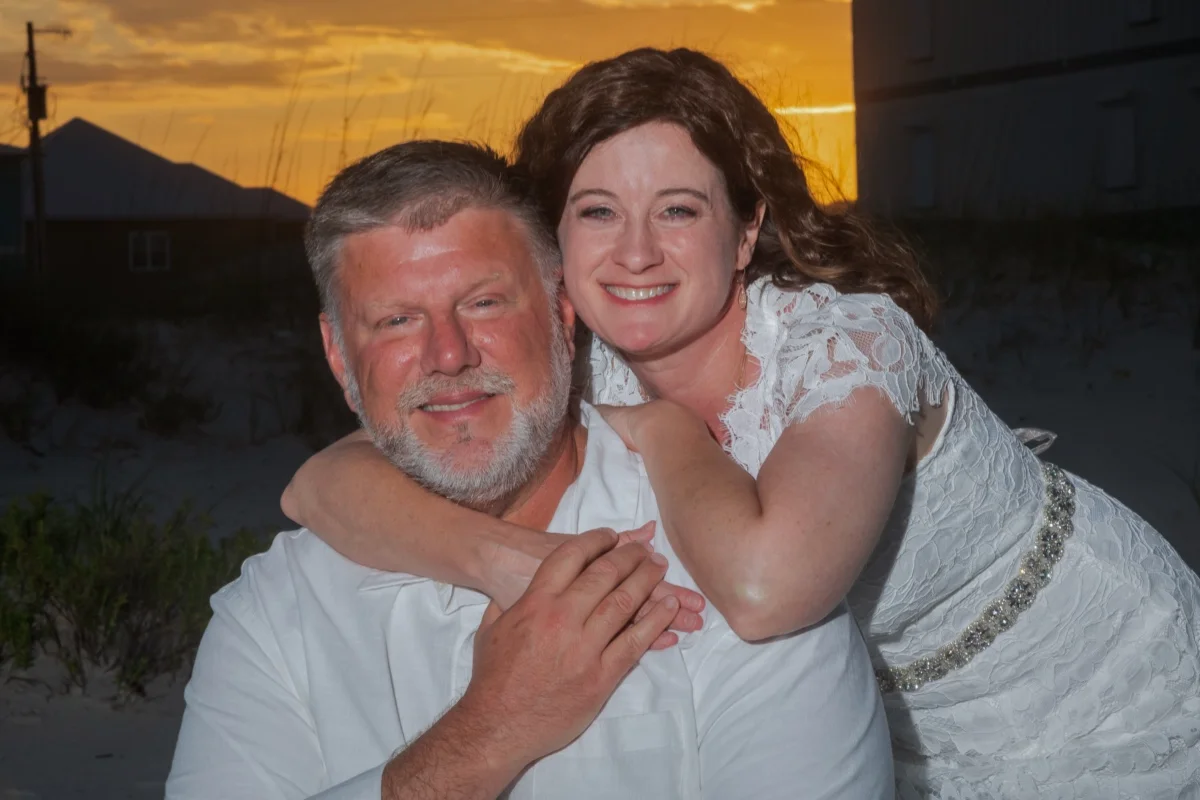 Bride and groom at sunset on the beach. Gulf Shores Beach Wedding.