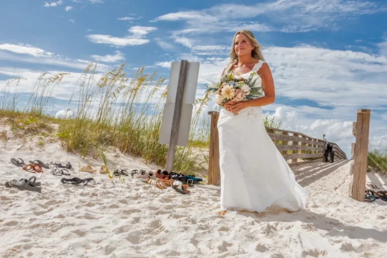 Gulfshore's wedding photographer, photo of the bride walking out on the beach during the beach wedding.