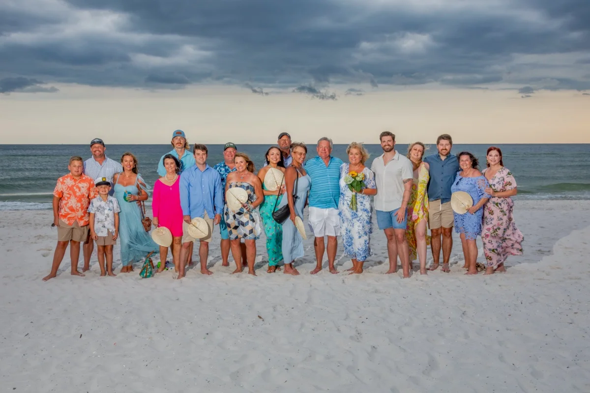 Beach Wedding Group standing on the sand by the water's edge in Gulf Shores, Alabama. 