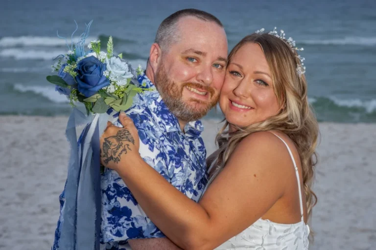 Photo of a couple on the beach after the wedding from Gulf Shores Photography.