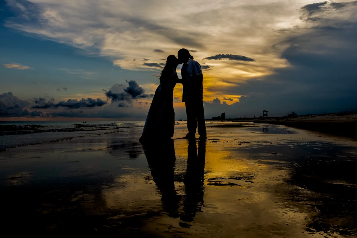Sunset photo silhouette of the bride and groom. Gulf Shores Photographer. 