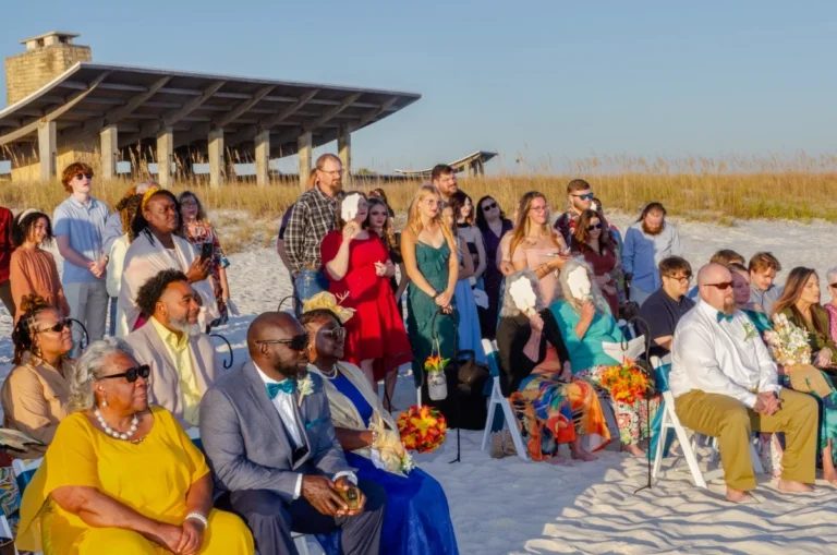 Photo of attendees at a Gulf Shores beach wedding shot by Gulf Shores photographer.