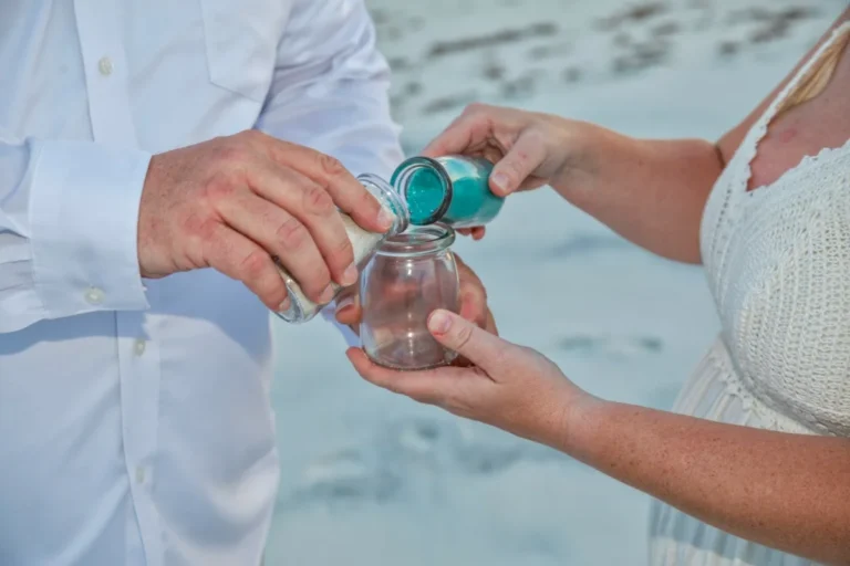 Bride and groom doing the sand ceremony shot by Gulf Shores photographer.